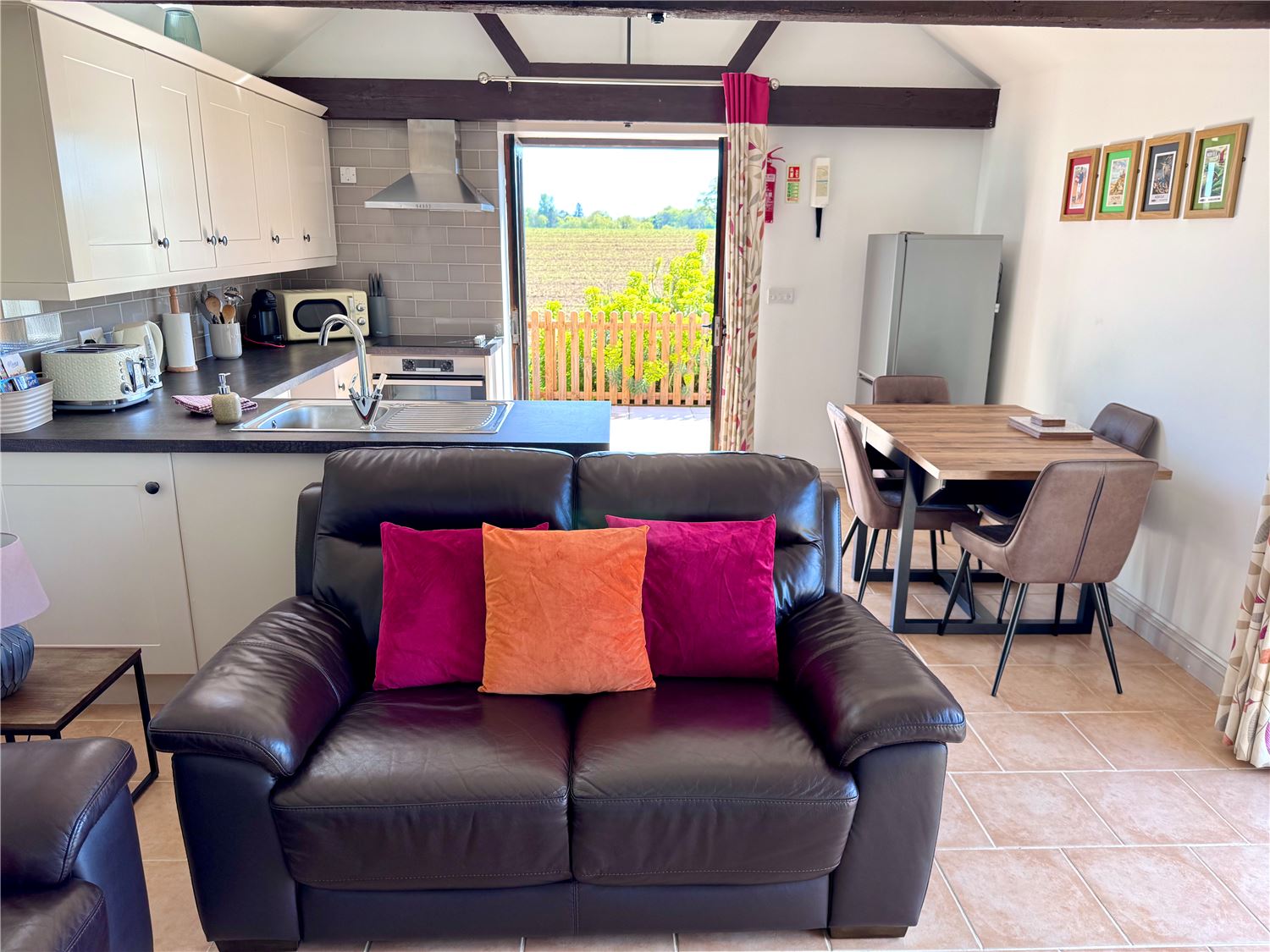Open plan living with well equipped kitchen and countryside views at dog friendly Norfolk Broads holiday cottage, sleeps 4
