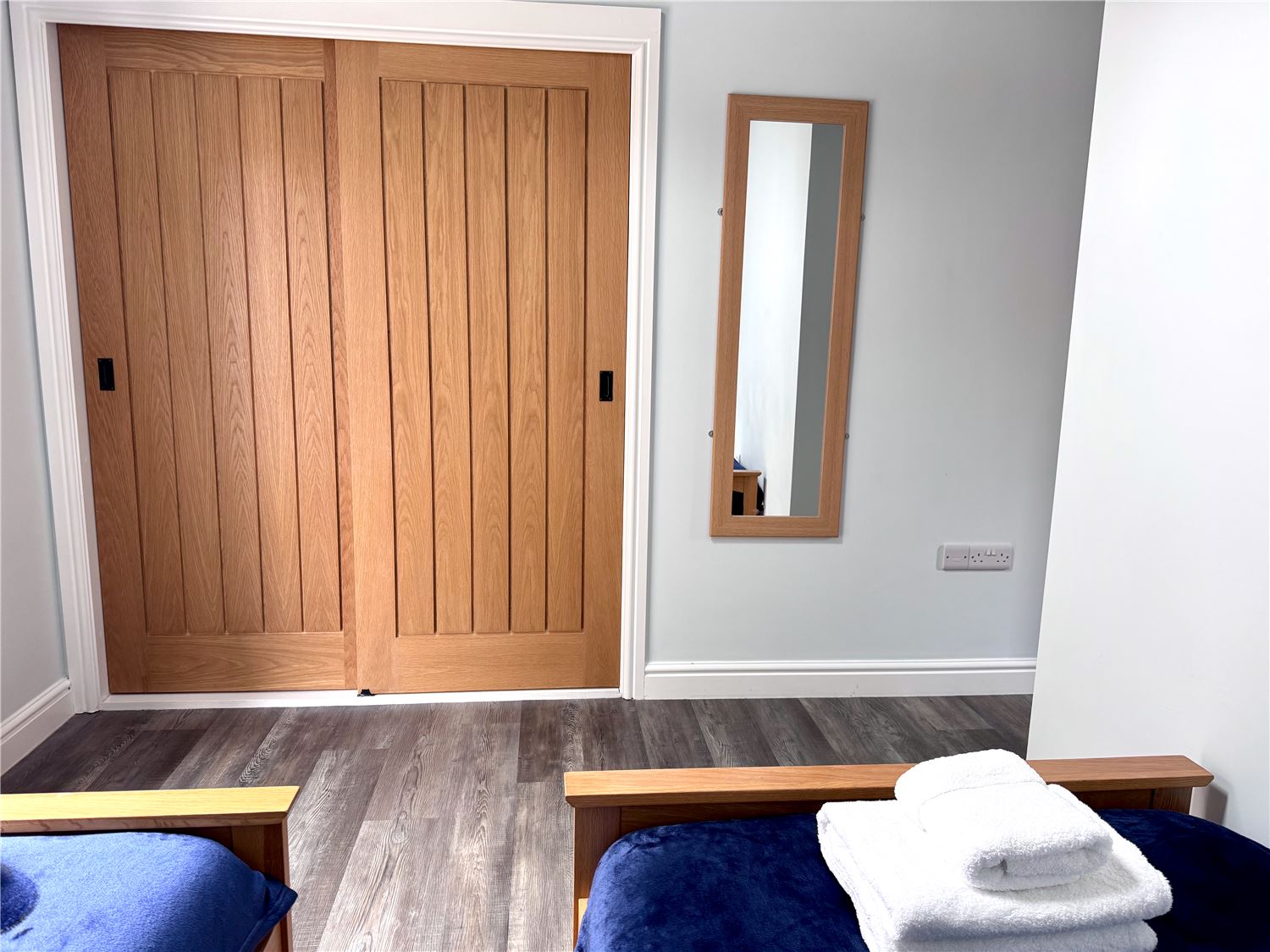 Twin bedroom with fitted wardrobes at dog-friendly Norfolk Broads holiday cottage sleeps 6
