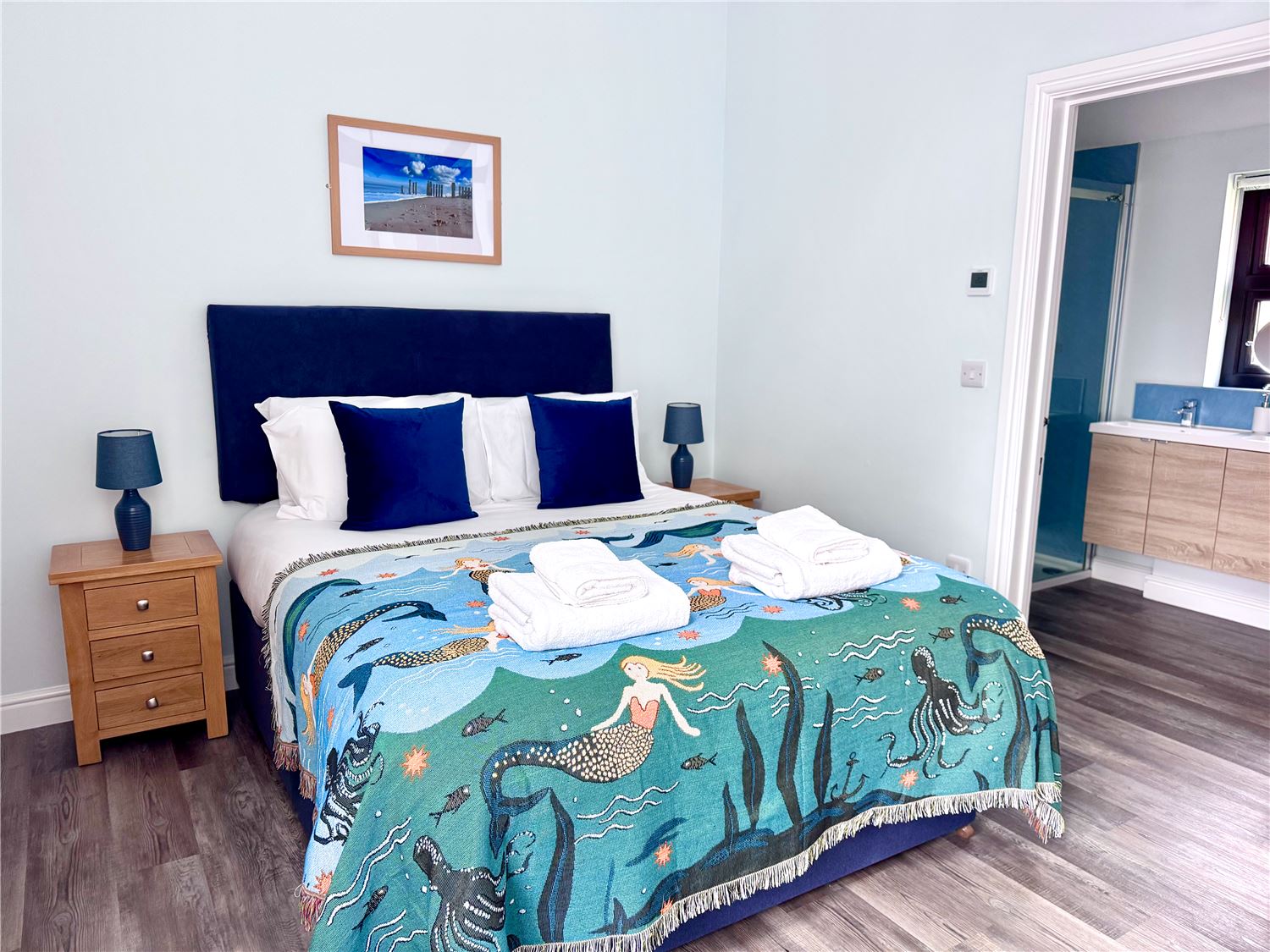 Kingsize bedroom with dressing table and TV at dog-friendly Norfolk Broads holiday cottage sleeps 6