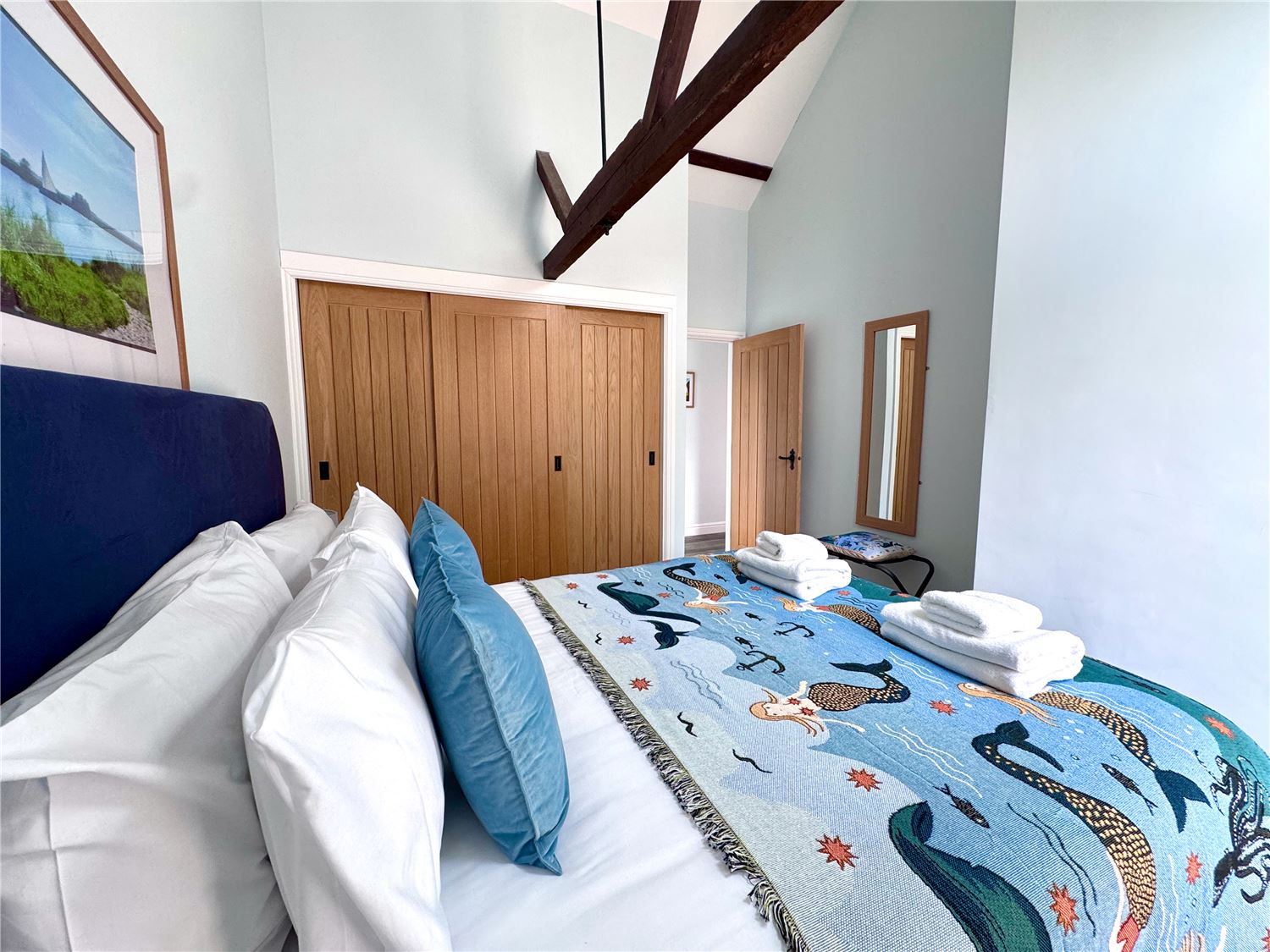 Kingsize bedroom with fitted wardrobes at dog-friendly Norfolk Broads holiday cottage sleeps 6