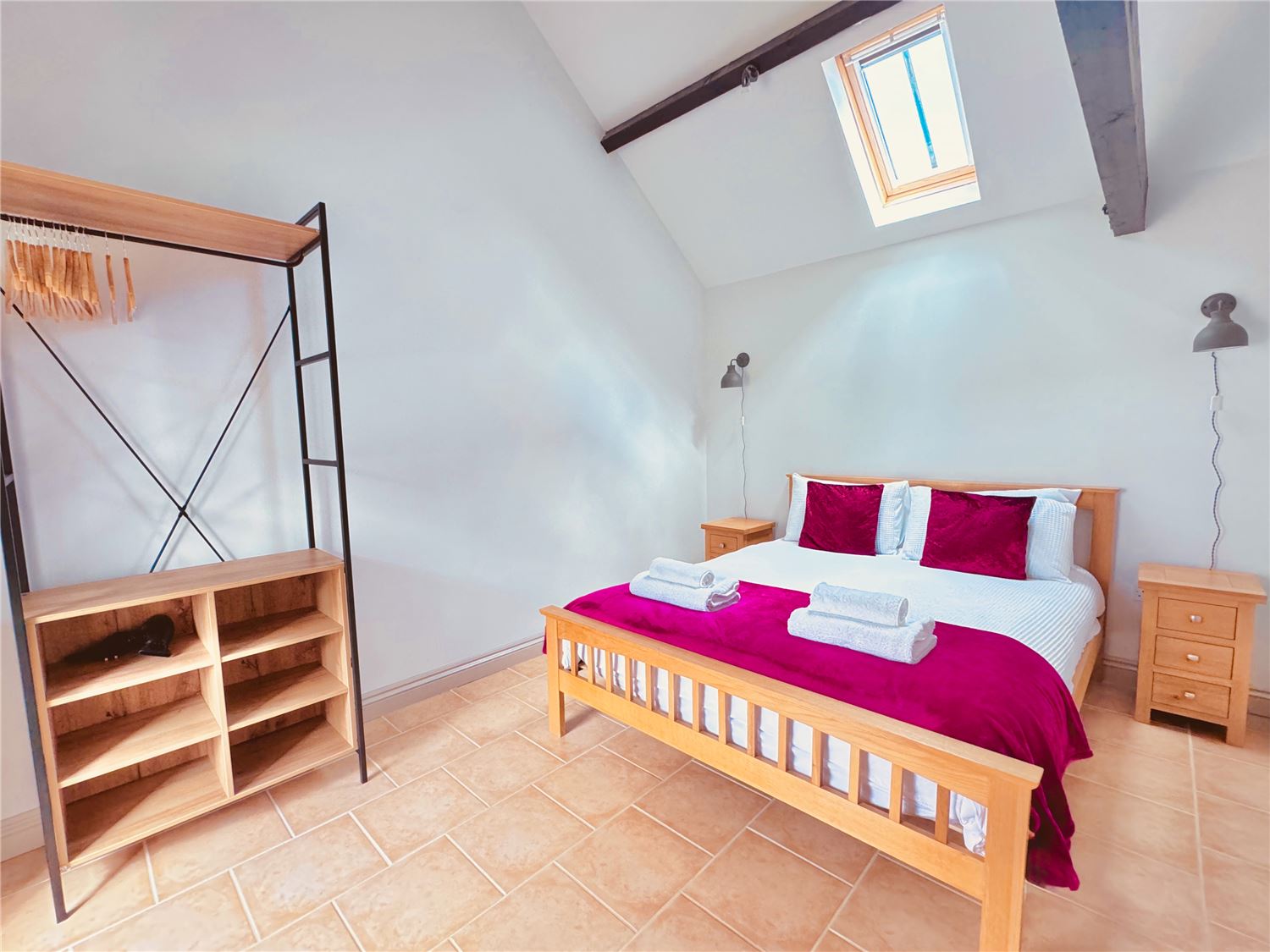 Kingsize bed at Norfolk Broads holiday cottage with space for travel cot