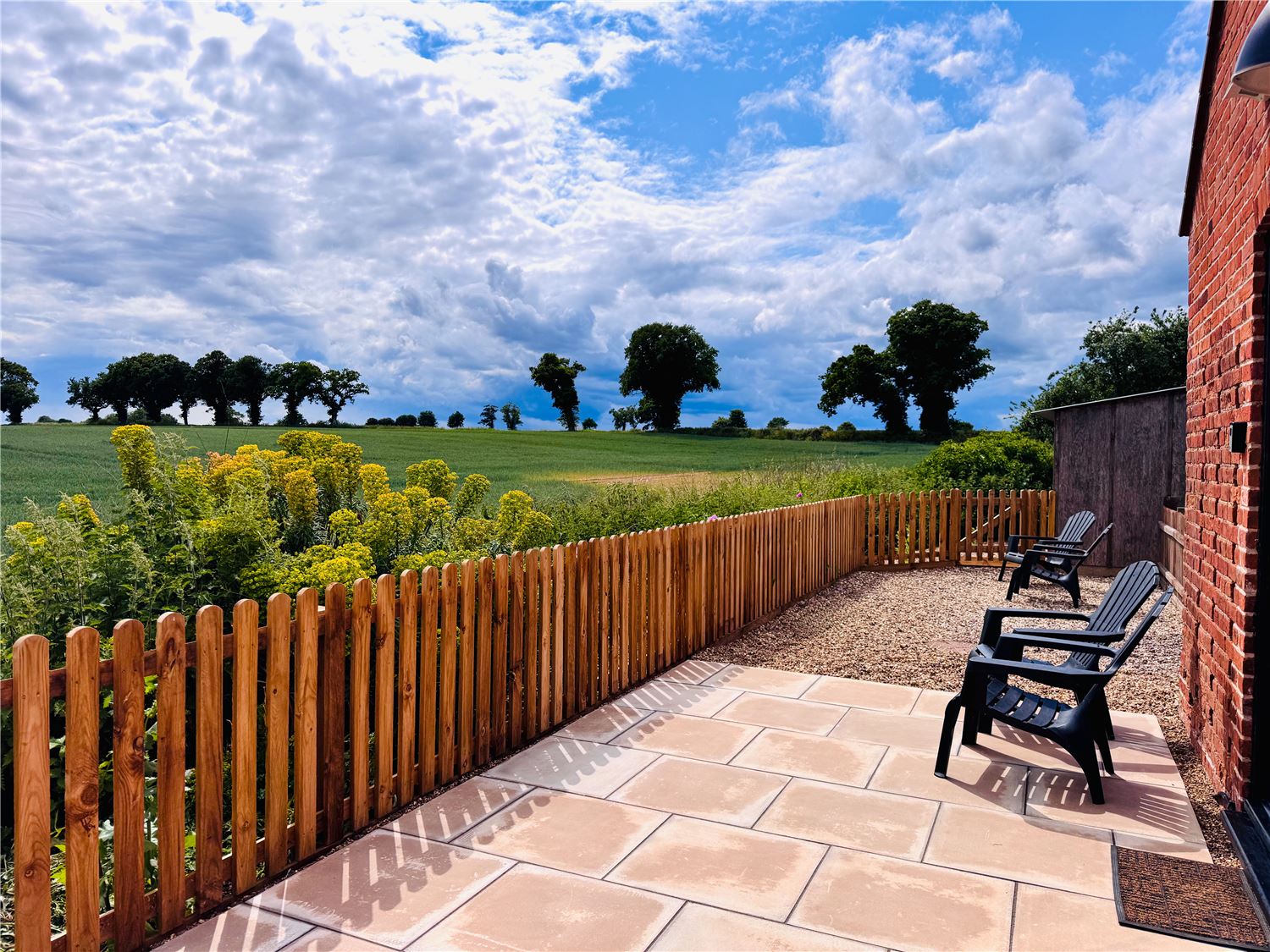 Large enclosed outdoor patio with countryside views at dog friendly Norfolk Broads holiday let sleeping 4